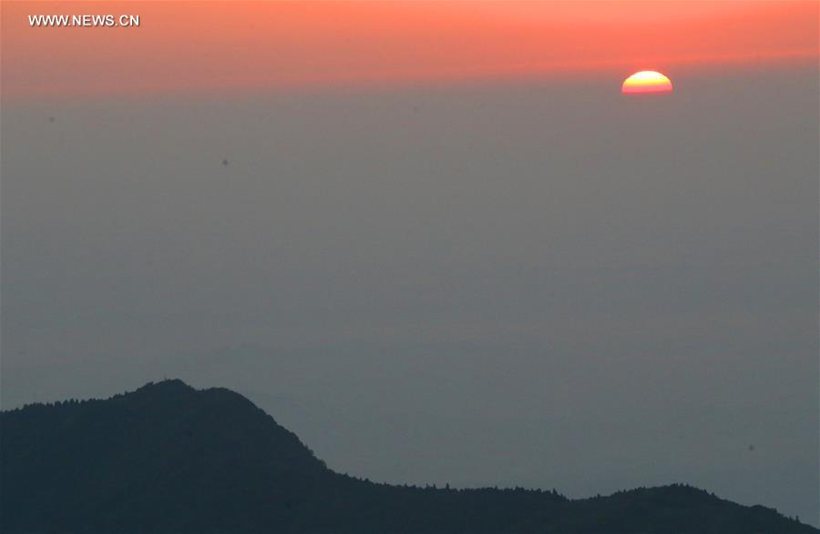 Tourists view sunrise at Hengshan Mountain scenic area in C China