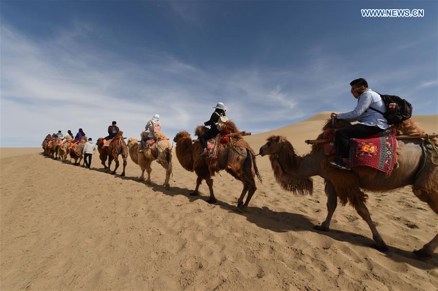 Mingsha Sand Mountain scenery zone in Dunhuang attracts tourists