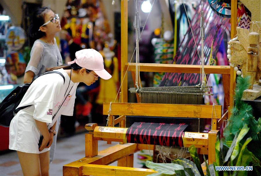 Tourists visit Int'l Bazar at Urumqi in NW China's Xinjiang