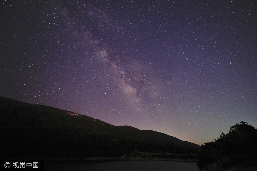 Milky Way illuminates night sky over small town in Jiangxi