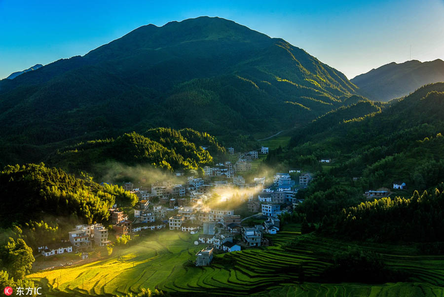 Morning view of autumn in mist at village in Jiangxi