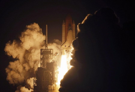 Space shuttle Discovery lifts off