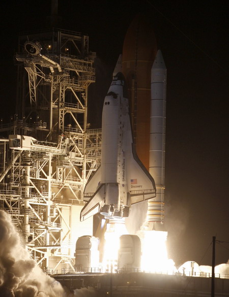 Space shuttle Discovery lifts off