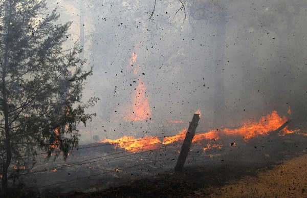 2 dead in Texas wildfires, homes destroyed