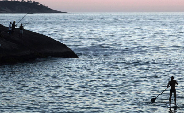 Surfer takes to the water in Rio de Janeiro