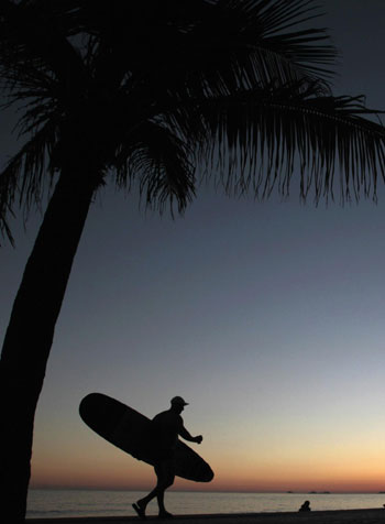 Surfer takes to the water in Rio de Janeiro