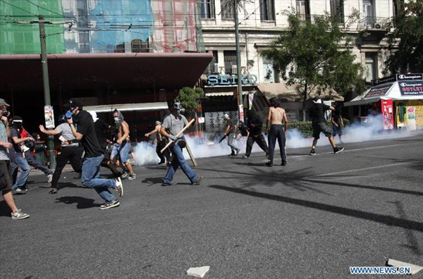 Protestors clash with anti-riot policemen in Athens