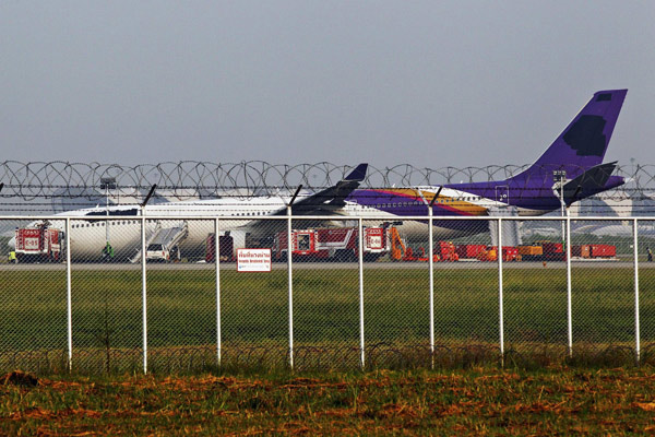 Plane skids off Bangkok runway, 13 injured