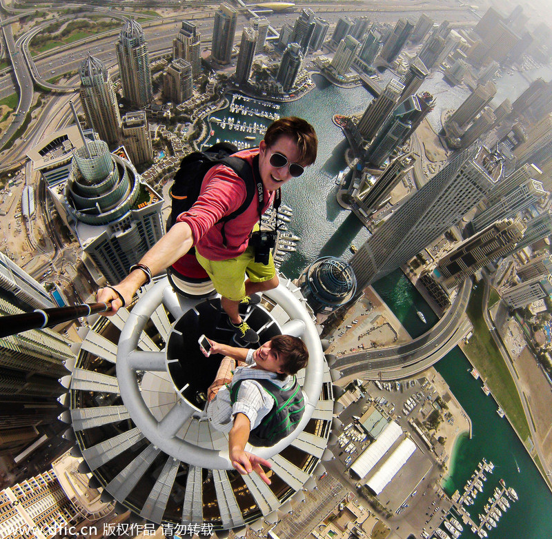 Daredevils taking selfie over Dubai skyscraper