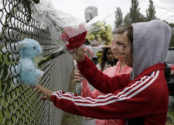 Police seek motive in fatal Washington state school shooting