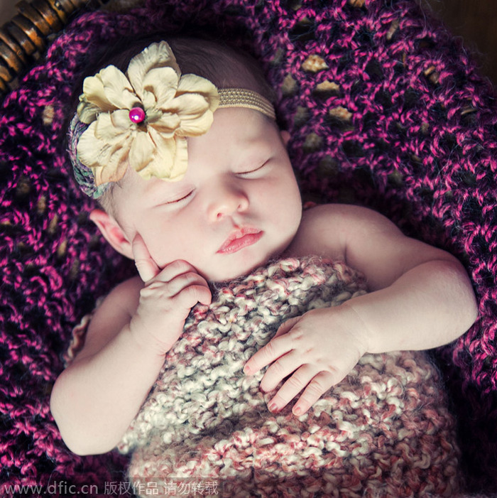 Sleeping newborns photographed in adorable poses