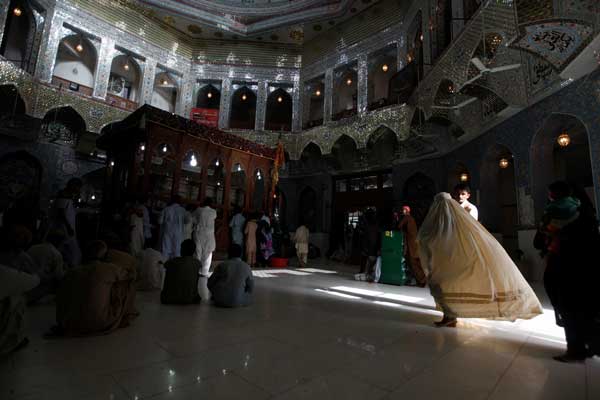 Suicide attack on Pakistani shrine kills 72, claimed by Islamic State