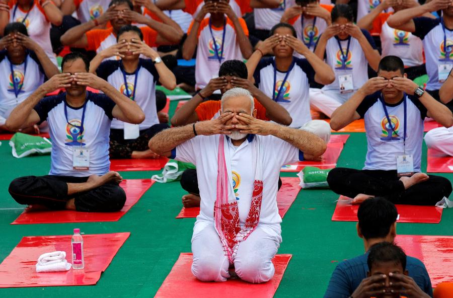 Thousands join India's Modi, hit the mat for International Yoga Day